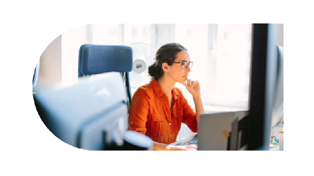 Woman looking out at computer