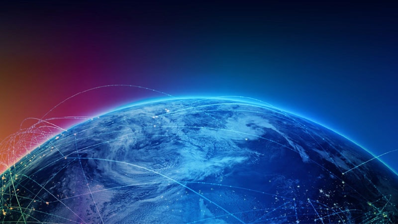 Earth from space with glowing network lines connecting different regions across the globe.