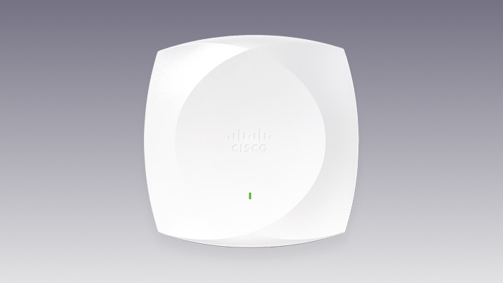 White Cisco wireless access point with a central logo and a green status light.